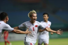 Văn Toàn sau khi ghi bàn thắng duy nhất của trận đấu. (Ảnh: Hoàng Linh/TTXVN)