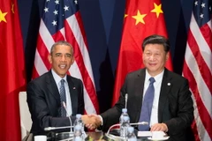 Tổng thống Mỹ Barack Obama (trái) và Chủ tịch Trung Quốc Tập Cận Bình trong cuộc hội đàm bên lề Hội nghị COP 21. (Nguồn: THX/TTXVN)