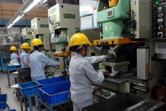 Sản xuất các linh kiện kim loại, cơ khí… tại Công ty Cơ khí Chính xác Việt Nam 1, 100% vốn đầu tư của Đài Loan. (Ảnh: Danh Lam/TTXVN)