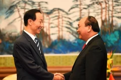 Thủ tướng Chính phủ Nguyễn Xuân Phúc tiếp Phó Chủ tịch Chính hiệp toàn quốc Trung Quốc Vương Gia Thụy. (Ảnh: Thống Nhất/TTXVN)