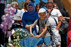 Tưởng nhớ các nạn nhân xấu số sau vụ tấn công kinh hoàng. (Nguồn: EPA)