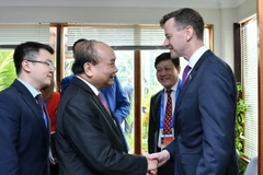 Thủ tướng Nguyễn Xuân Phúc tiếp đoàn Liên minh Doanh nghiệp Hoa Kỳ. (Ảnh: Thống Nhất/TTXVN)