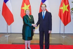 Chủ tịch nước Trần Đại Quang tổ chức Quốc yến chiêu đãi trọng thể Tổng thống Michelle Bachelet Jeria cùng các thành viên trong Đoàn đại biểu cấp cao Cộng hòa Chile thăm cấp Nhà nước tới Việt Nam. (Ảnh: Nhan Sáng/TTXVN)