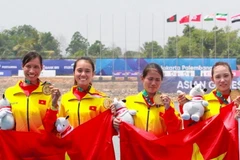 Đội tuyển rowing nữ giành HCV đầu tiên cho đoàn thể thao Việt Nam. (Ảnh: TTXVN phát)