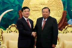 Tổng Bí thư, Chủ tịch nước Lào Bounnhang Volachith tiếp đoàn đại biểu Trung ương Hội Hữu nghị Việt Nam-Lào. (Ảnh: Phạm Kiên/Vietnam+)