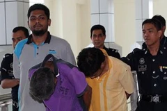 Hai kẻ bắt cóc bị bắt giữ. (Nguồn: bernama.com)