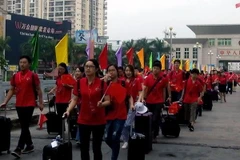 Các đại biểu thanh niên Trung Quốc đến Quảng Ninh để tham dự liên hoan. (Ảnh: Nguyễn Hoàng/TTXVN)