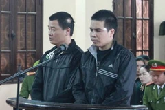 Hai bị cáo Nguyễn Tuấn Dũng và Đinh Văn Huỳnh.