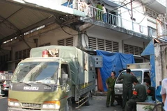 Địa điểm sản xuất đĩa lậu tại nhà kho 360B Bến Vân Đồn. (Ảnh: Thế Vinh/TTXVN) 