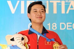 Xạ thủ Ngô Hữu Vượng nhận huy chương vàng cá nhân. (Ảnh:Quốc Khánh/TTXVN)