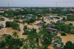 Nhiều ngôi nhà bị ngập do mưa lũ ở huyện Cam Lộ, tỉnh Quảng Trị. (Nguồn ảnh: TTXVN)