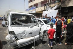 Hiện trường vụ đánh bom xe ở Sadr City, Baghdad, Iraq ngày 11/5. (Nguồn: AFP/TTXVN)