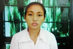 Đối tượng Nguyễn Thị Lan tại cơ quan điều tra. (Ảnh: Văn Đạt/TTXVN)