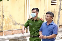 Lê Văn Trường được áp giải về nơi tạm giam. (Ảnh: TTXVN phát)