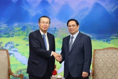 Thủ tướng Phạm Minh Chính tiếp ông Ishiguro Norihiko, Chủ tịch Tổ chức Xúc tiến Thương mại Nhật Bản (JETRO). (Ảnh: Dương Giang/TTXVN)