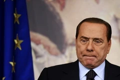 Việc Thủ tướng Italy Berlusconi phải từ chức là điều bắt buộc phải đến (Nguồn: AFP/TTXVN)