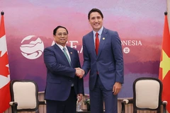 Thủ tướng Phạm Minh Chính gặp Thủ tướng Canada Justin Trudeau. (Ảnh: Dương Giang/TTXVN)