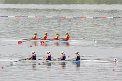 Đội thuyền bốn nữ hạng nặng môn rowing (Đinh Thị Hảo, Dư Thị Bông, Phạm Thị Huệ, Hà Thị Vui) giành huy chương Đồng. (Ảnh: Hoàng Linh/TTXVN)
