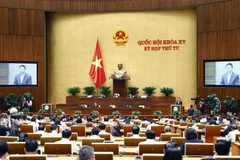 Bộ trưởng Bộ Thông tin và Truyền thông Nguyễn Mạnh Hùng trình bày Tờ trình về dự án Luật Giao dịch điện tử (sửa đổi). (Ảnh: Doãn Tấn/TTXVN)