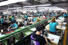 Xưởng sản xuất giày da tại thành phố Thủ Đức. (Ảnh: Hồng Đạt/TTXVN)