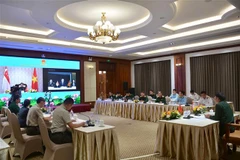 Quang cảnh cuộc họp tại điểm cầu Hà Nội. (Ảnh: Hồng Pha/TTXVN phát)