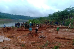 Hiện trường vụ sạt lở đất tại xã Đắk Sin, huyện Đắk R’lấp, tỉnh Đắk Nông. (Ảnh: TTXVN phát)