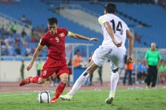 Việt Nam và Iraq cùng quyết tâm giành chiến thắng. (Ảnh: Minh Chiến/Vietnam+)