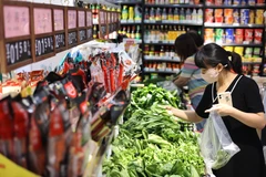 ADB: Người dân hạn chế mua sắm kìm hãm đà phục hồi của Trung Quốc