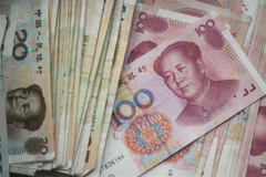 Đồng nhân dân tệ tại một ngân hàng ở Bắc Kinh, Trung Quốc. (Ảnh: AFP/TTXVN)