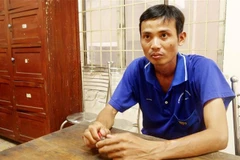 Đối tượng Nguyễn Minh Tâm tại cơ quan điều tra. (Ảnh: Công Mạo/TTXVN)