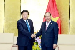 Thủ tướng Nguyễn Xuân Phúc tiếp ông Lý Khánh Khôi, Chủ tịch Tập đoàn Lưới điện Phương Nam (Trung Quốc). (Nguồn: TTXVN)