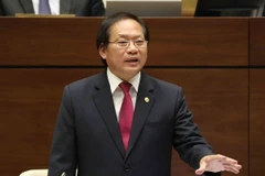 Bộ trưởng Bộ Thông tin và Truyền thông Trương Minh Tuấn trả lời chất vấn của đại biểu Quốc hội. (Ảnh: Phương Hoa/TTXVN)