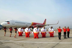 Đội ngũ tiếp viên hàng không Vietjet Air. (Ảnh: CTV/Vietnam+)