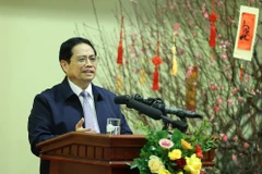 Thủ tướng Phạm Minh Chính chúc Tết và giao nhiệm vụ cho ngành ngân hàng. (Ảnh: Dương Giang/TTXVN)