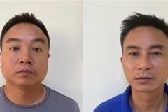 Các đối tượng cản trở, hành hung phóng viên khi đang tác nghiệp. (Ảnh: TTXVN phát)