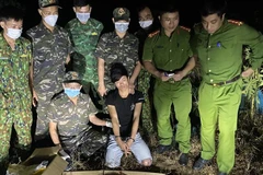 Đối tượng Hồ A Xuân bị bắt giữ. (Ảnh: TTXVN phát)