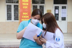 Thí sinh dự thi môn Ngữ văn. (Ảnh: Hoài Nam/Vietnam+)