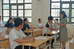 Thí sinh dự thi tốt nghiệp trung học phổ thông. (Ảnh: Phạm Mai/Vietnam+)