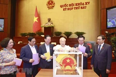 Tổng Bí thư Nguyễn Phú Trọng và các lãnh đạo Đảng, Nhà nước bỏ phiếu tín nhiệm. (Ảnh: Doãn Tấn/TTXVN)