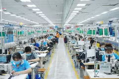 Kinh tế đất nước đã có chuyển biến tích cực. (Ảnh: TTXVN)