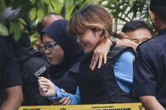 Đoàn Thị Hương bị dẫn giải ra tòa trong một phiên xử. (Nguồn: Reuters)