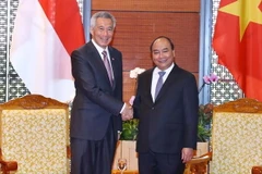 Tại Trung tâm Hội nghị quốc gia (Hà Nội), Thủ tướng Nguyễn Xuân Phúc tiếp Thủ tướng Singapore Lý Hiển Long nhân dịp sang Việt Nam dự Hội nghị Diễn đàn Kinh tế thế giới về ASEAN 2018. (Ảnh: Thống Nhất/TTXVN)