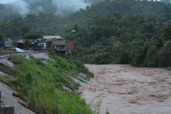 Nước sông chảy qua địa phận huyện Nậm Pồ (Điện Biên) dâng cao, chảy xiết. (Ảnh: Văn Dũng/TTXVN)