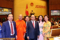 Thủ tướng Nguyễn Xuân Phúc và các đại biểu Quốc hội dự khai mạc kỳ họp lần thứ 11. (Ảnh: Thống Nhất/TTXVN)