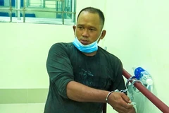Đối tượng Trương Ngọc Long tại cơ quan Công an. (Ảnh: TTXVN phát)
