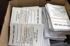 Tang vật hoạt động cho vay nặng lãi bị thu giữ. (Ảnh: Thanh Tân/TTXVN)