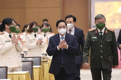 Thủ tướng Phạm Minh Chính đến dự buổi gặp mặt đoàn đại biểu dự Đại hội đại biểu Phụ nữ Bộ Công an lần IX. (Ảnh: Dương Giang/TTXVN) 