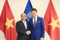 Chủ tịch nước Nguyễn Xuân Phúc với Tổng giám đốc Tổ chức Sở hữu trí tuệ thế giới (WIPO) Daren Tang. (Ảnh: Thống Nhất/TTXVN) 