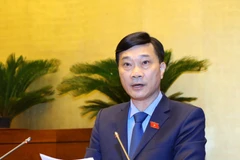 Chủ nhiệm Ủy ban Kinh tế của Quốc hội Vũ Hồng Thanh trình bày Báo cáo giải trình, tiếp thu, chỉnh lý dự thảo Nghị quyết về quy hoạch sử dụng đất quốc gia thời kỳ 2021-2030, tầm nhìn đến năm 2050 và kế hoạch sử dụng đất 5 năm (2021-2025). (Ảnh: Văn Điệp/TT