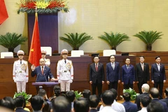 Chủ tịch nước Nguyễn Xuân Phúc tuyên thệ nhậm chức. (Ảnh: Doãn Tấn/TTXVN)